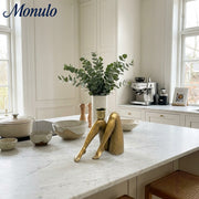 Base de vela dorada escultórica Kickra - Decoración para comedor y sala